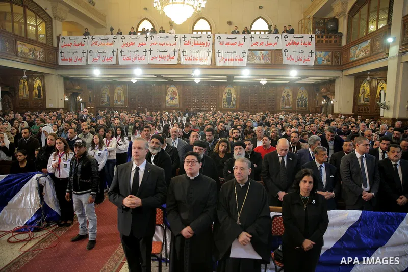 Egyptian Christians attend the funeral of the victims of a bomb explosion that targeted a Coptic Orthodox Church the previous day in Cairo, in the Egyptian capital's Nassr City neighbourhood on December 12, 2016. Photo b...