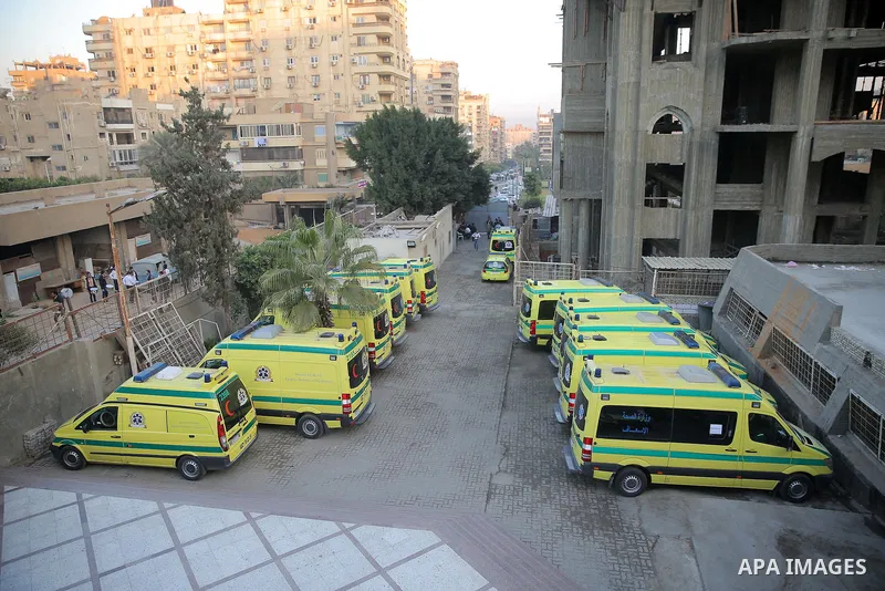 Coffins are taken into ambulances after the funeral of the victims of a bomb explosion that targeted a Coptic Orthodox Church the previous day in Cairo, in the Egyptian capital's Nassr City neighbourhood on December 12,...