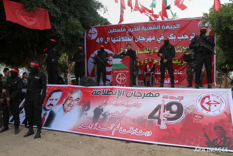 Palestinians take part in a rally marking the 49th anniversary of the founding of the Popular Front for the Liberation of Palestine (PFLP), in Rafah in the southern Gaza strip, on 13 December 2016. Photo by Abed Rahim Kh...