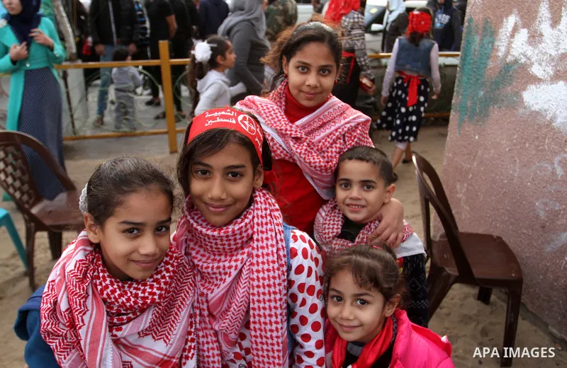 Palestinians take part in a rally marking the 49th anniversary of the founding of the Popular Front for the Liberation of Palestine (PFLP), in Rafah in the southern Gaza strip, on 13 December 2016. Photo by Abed Rahim Kh...