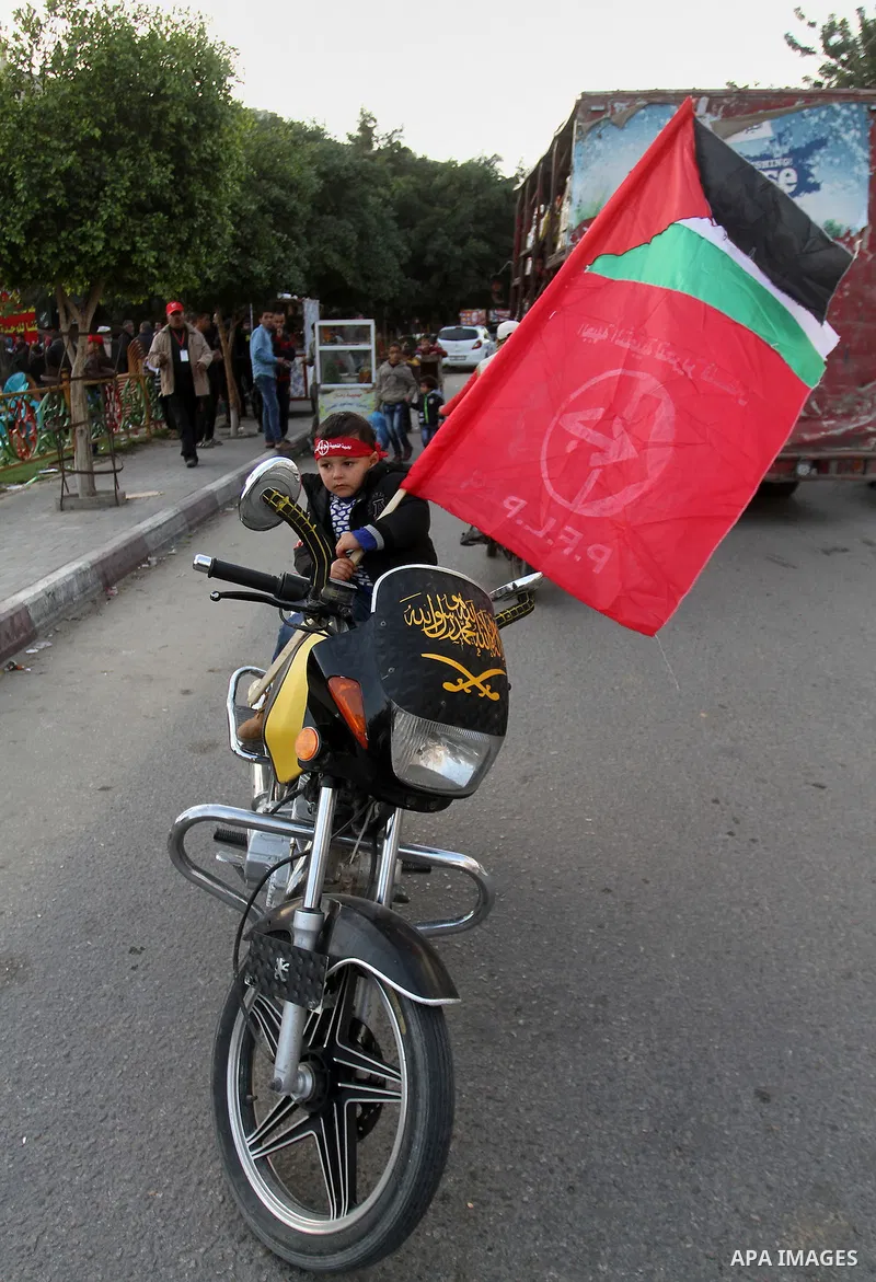 Palestinians take part in a rally marking the 49th anniversary of the founding of the Popular Front for the Liberation of Palestine (PFLP), in Rafah in the southern Gaza strip, on 13 December 2016. Photo by Abed Rahim Kh...