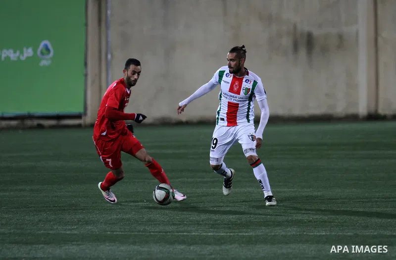 Palestino players and Chile players compete during their friendly soccer match between Palestine and CD Palestino at Nablus Stadium in The West Bank City of Nablus, 13 December 2016. CD Palestino visit West Bank and Gaza...