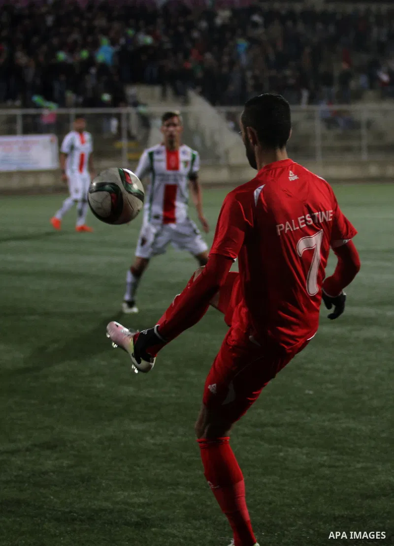Palestino players and Chile players compete during their friendly soccer match between Palestine and CD Palestino at Nablus Stadium in The West Bank City of Nablus, 13 December 2016. CD Palestino visit West Bank and Gaza...