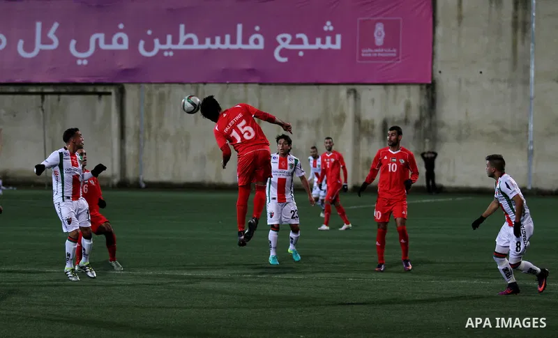 Palestino players and Chile players compete during their friendly soccer match between Palestine and CD Palestino at Nablus Stadium in The West Bank City of Nablus, 13 December 2016. CD Palestino visit West Bank and Gaza...