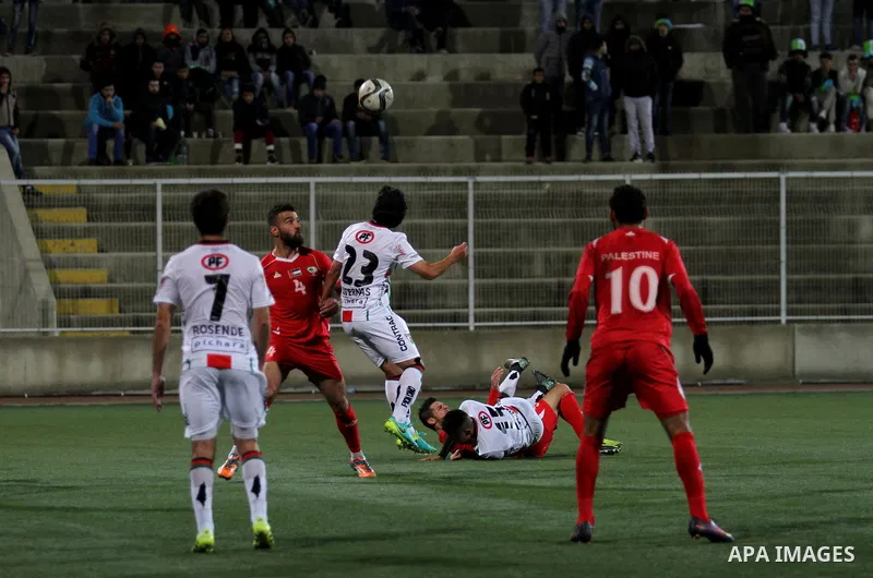 Palestino players and Chile players compete during their friendly soccer match between Palestine and CD Palestino at Nablus Stadium in The West Bank City of Nablus, 13 December 2016. CD Palestino visit West Bank and Gaza...