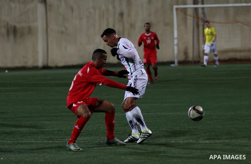 Palestino players and Chile players compete during their friendly soccer match between Palestine and CD Palestino at Nablus Stadium in The West Bank City of Nablus, 13 December 2016. CD Palestino visit West Bank and Gaza...
