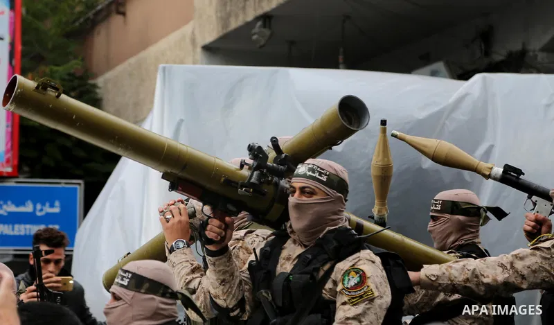 Palestinian militants take part in a rally marking the 29th anniversary of the founding of the Hamas movement, in Gaza city December 14, 2016. Photo by Ashraf Amra