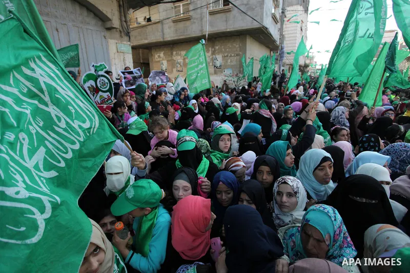 Palestinian Hamas supporters take part during a rally marking the 29th anniversary of the founding of the Hamas movement, in Nuseirat refugee camp in the central Gaza Strip, December 16, 2016. . Photo by Ashraf Amra