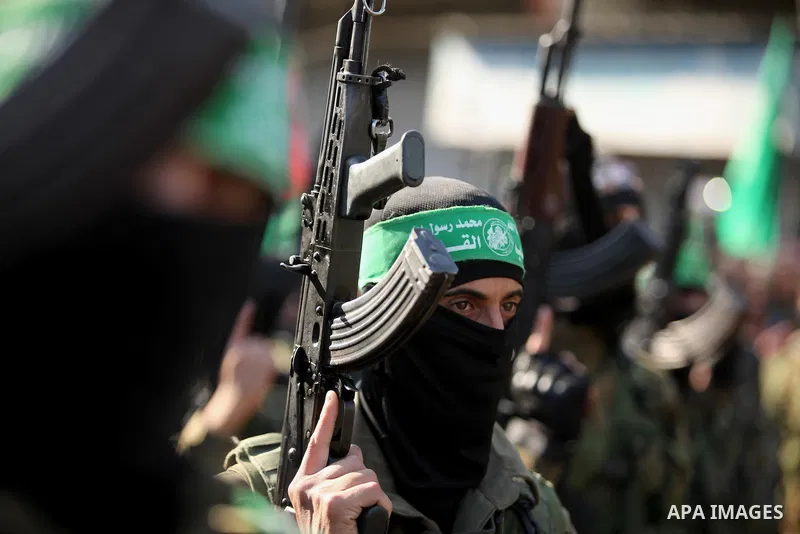 Palestinian Hamas militants take part in a rally marking the 29th anniversary of the founding of the Hamas movement in Nuseirat refugee camp in the central Gaza Strip, December 16, 2016. Photo by Ashraf Amra