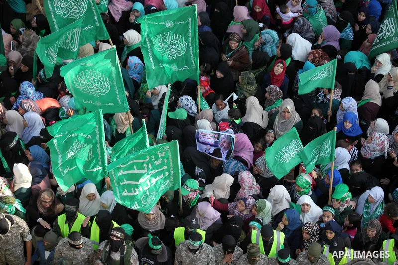Palestinian Hamas supporters take part during a rally marking the 29th anniversary of the founding of the Hamas movement, in Nuseirat refugee camp in the central Gaza Strip, December 16, 2016. . Photo by Ashraf Amra