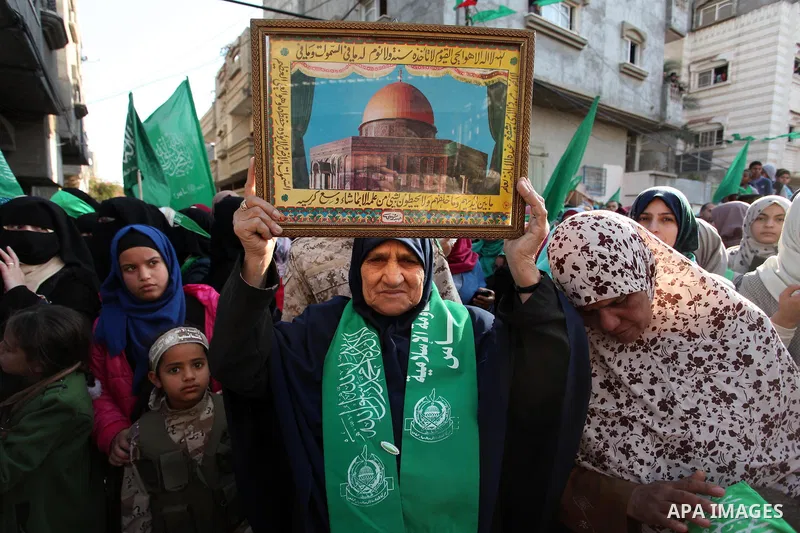 Palestinian Hamas supporters take part during a rally marking the 29th anniversary of the founding of the Hamas movement, in Nuseirat refugee camp in the central Gaza Strip, December 16, 2016. . Photo by Ashraf Amra