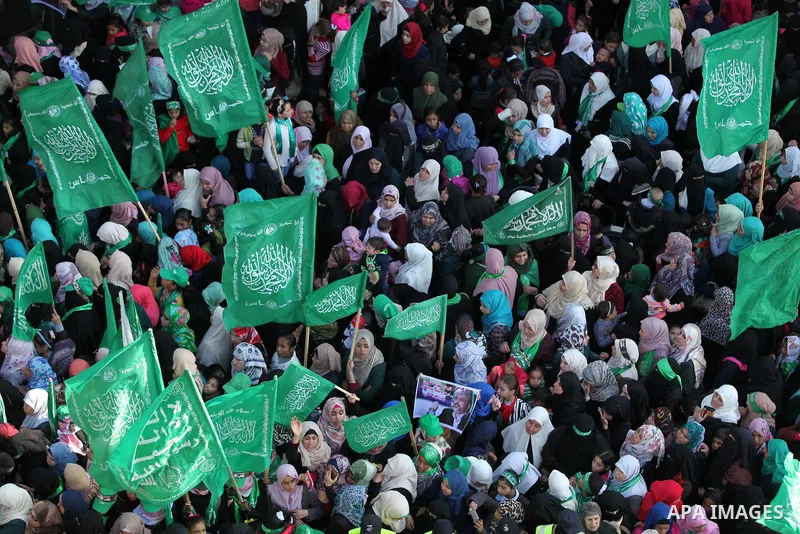 Palestinian Hamas supporters take part during a rally marking the 29th anniversary of the founding of the Hamas movement, in Nuseirat refugee camp in the central Gaza Strip, December 16, 2016. . Photo by Ashraf Amra