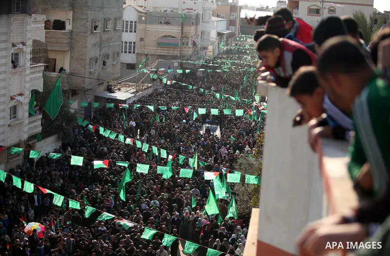 Palestinian Hamas supporters take part during a rally marking the 29th anniversary of the founding of the Hamas movement, in Nuseirat refugee camp in the central Gaza Strip, December 16, 2016. . Photo by Ashraf Amra