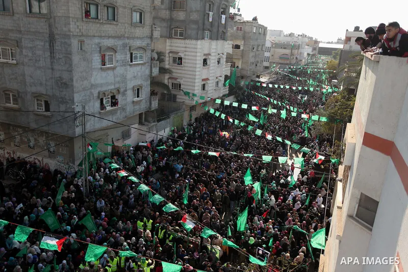 Palestinian Hamas supporters take part during a rally marking the 29th anniversary of the founding of the Hamas movement, in Nuseirat refugee camp in the central Gaza Strip, December 16, 2016. . Photo by Ashraf Amra