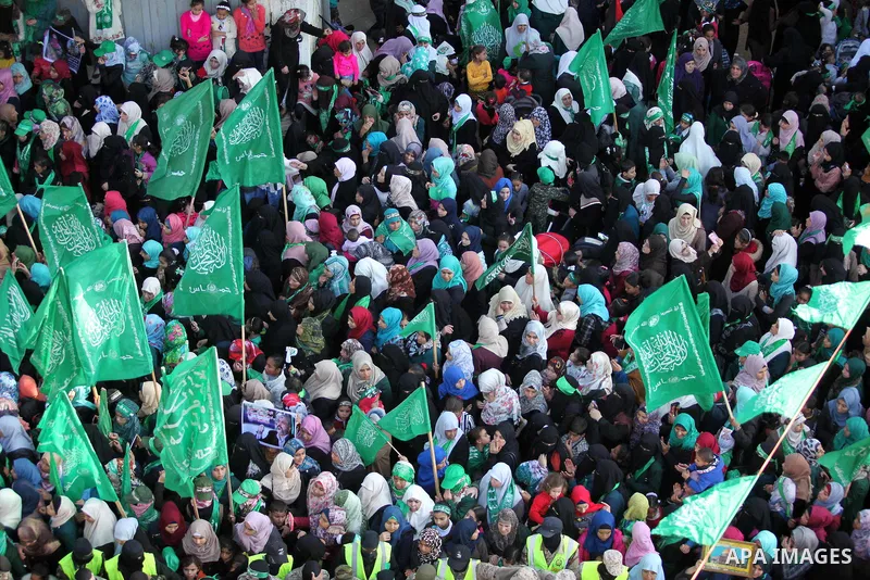 Palestinian Hamas supporters take part during a rally marking the 29th anniversary of the founding of the Hamas movement, in Nuseirat refugee camp in the central Gaza Strip, December 16, 2016. . Photo by Ashraf Amra
