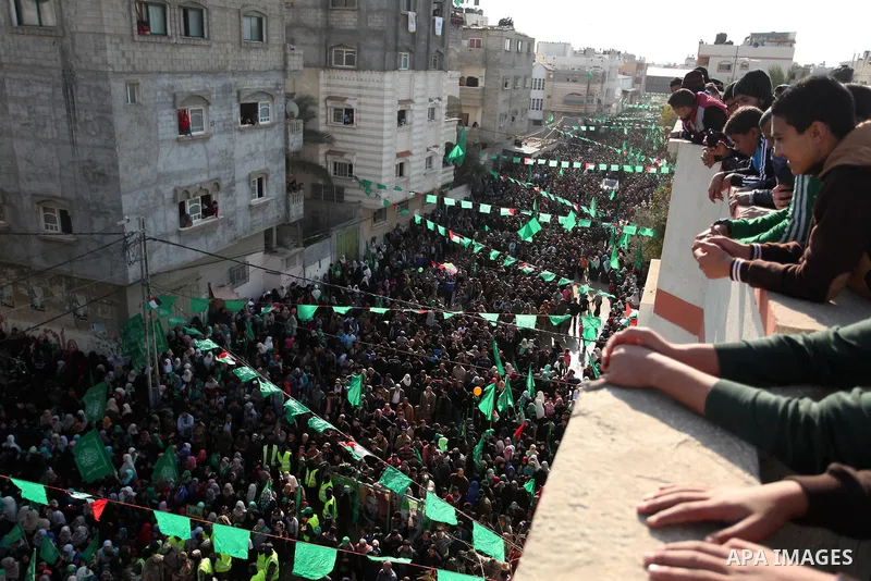 Palestinian Hamas supporters take part during a rally marking the 29th anniversary of the founding of the Hamas movement, in Nuseirat refugee camp in the central Gaza Strip, December 16, 2016. . Photo by Ashraf Amra