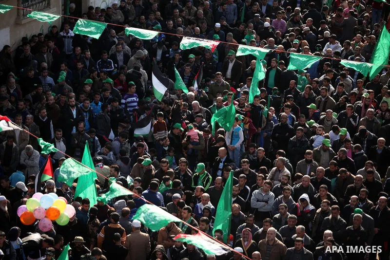 Palestinian Hamas supporters take part during a rally marking the 29th anniversary of the founding of the Hamas movement, in Nuseirat refugee camp in the central Gaza Strip, December 16, 2016. . Photo by Ashraf Amra