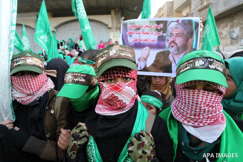 Palestinian Hamas supporters take part during a rally marking the 29th anniversary of the founding of the Hamas movement, in Nuseirat refugee camp in the central Gaza Strip, December 16, 2016. . Photo by Ashraf Amra
