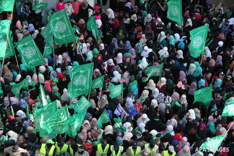 Palestinian Hamas supporters take part during a rally marking the 29th anniversary of the founding of the Hamas movement, in Nuseirat refugee camp in the central Gaza Strip, December 16, 2016. . Photo by Ashraf Amra