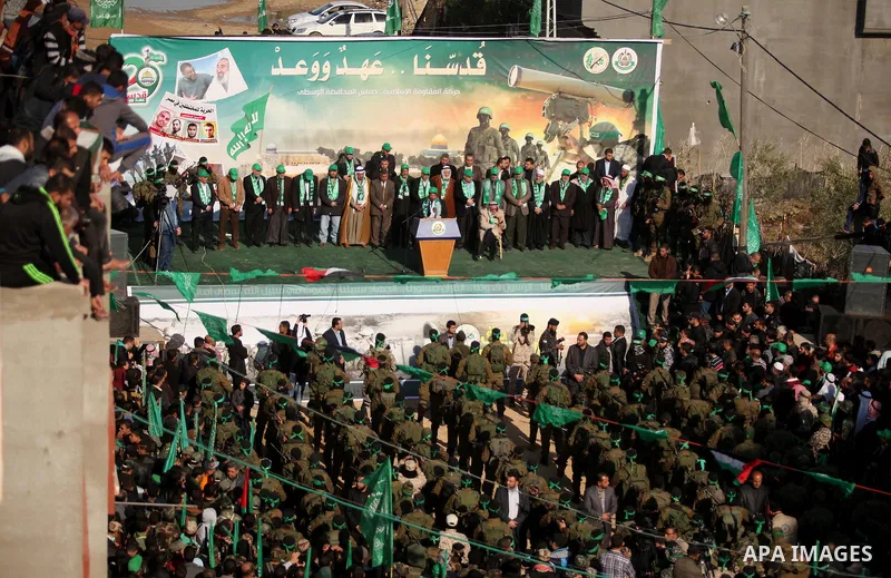 Palestinian Hamas supporters take part during a rally marking the 29th anniversary of the founding of the Hamas movement, in Nuseirat refugee camp in the central Gaza Strip, December 16, 2016. . Photo by Ashraf Amra