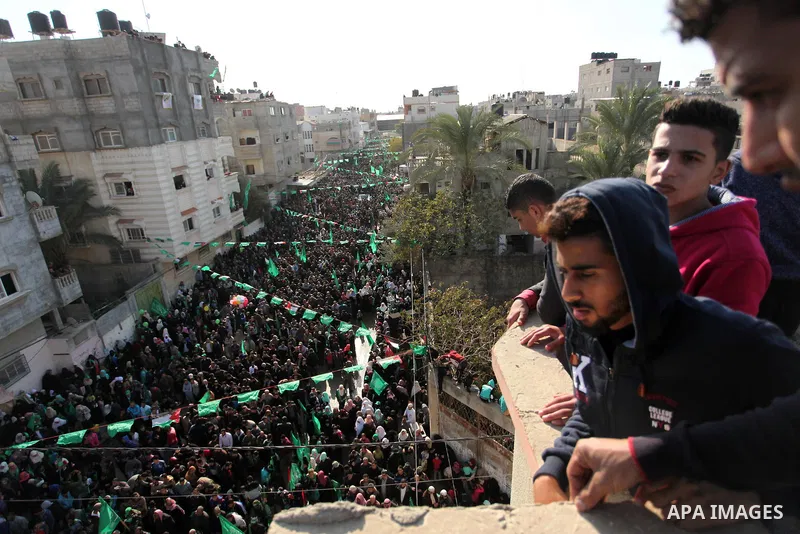 Palestinian Hamas supporters take part during a rally marking the 29th anniversary of the founding of the Hamas movement, in Nuseirat refugee camp in the central Gaza Strip, December 16, 2016. . Photo by Ashraf Amra