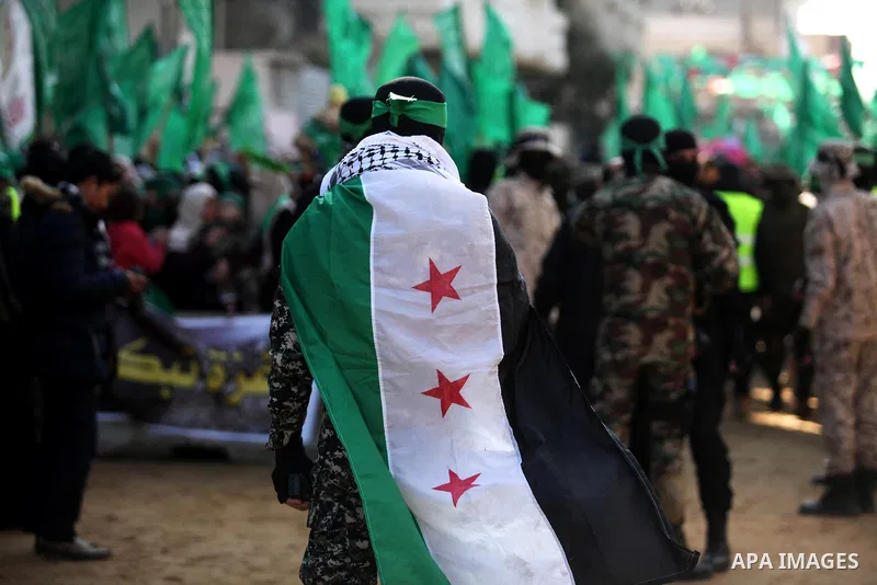 Palestinian Hamas supporters take part during a rally marking the 29th anniversary of the founding of the Hamas movement, in Nuseirat refugee camp in the central Gaza Strip, December 16, 2016. . Photo by Ashraf Amra