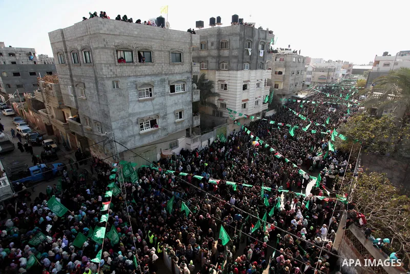 Palestinian Hamas supporters take part during a rally marking the 29th anniversary of the founding of the Hamas movement, in Nuseirat refugee camp in the central Gaza Strip, December 16, 2016. . Photo by Ashraf Amra