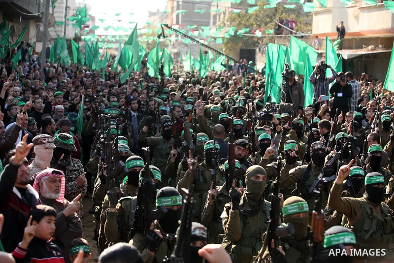 Palestinian Hamas supporters take part during a rally marking the 29th anniversary of the founding of the Hamas movement, in Nuseirat refugee camp in the central Gaza Strip, December 16, 2016. . Photo by Ashraf Amra