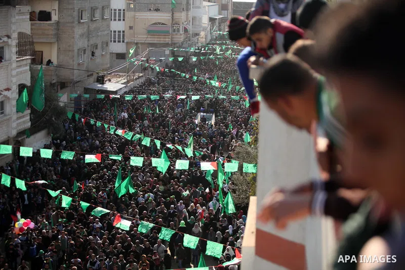 Palestinian Hamas supporters take part during a rally marking the 29th anniversary of the founding of the Hamas movement, in Nuseirat refugee camp in the central Gaza Strip, December 16, 2016. . Photo by Ashraf Amra