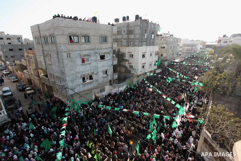 Palestinian Hamas supporters take part during a rally marking the 29th anniversary of the founding of the Hamas movement, in Nuseirat refugee camp in the central Gaza Strip, December 16, 2016. . Photo by Ashraf Amra