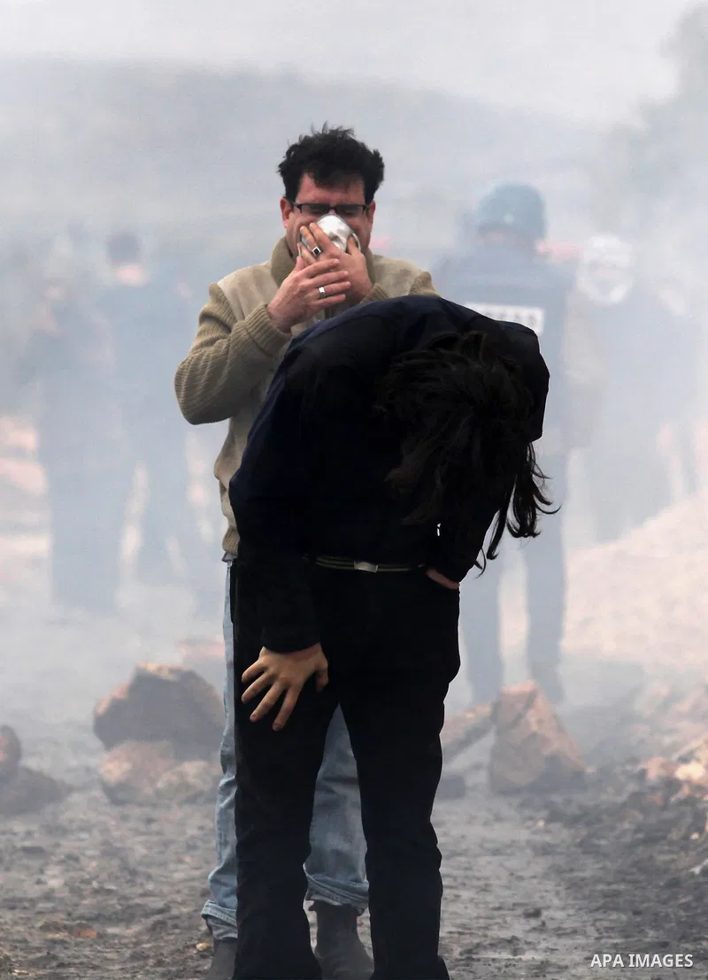 Palestinian protesters clash with Israeli security forces following a demonstration against the expropriation of Palestinian land by Israel in the village of Kfar Qaddum, near Nablus, in the occupied West Bank on Decembe...