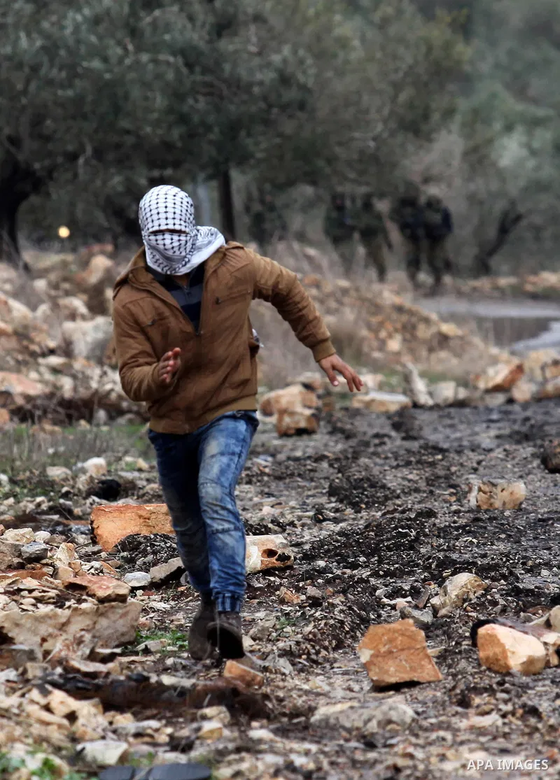 Palestinian protesters clash with Israeli security forces following a demonstration against the expropriation of Palestinian land by Israel in the village of Kfar Qaddum, near Nablus, in the occupied West Bank on Decembe...