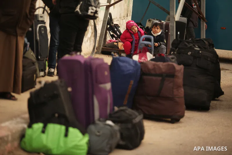 Palestinians wait for travel permits to cross into Egypt through the Rafah border crossing after it was opened by Egyptian authorities for humanitarian cases, in Rafah in the southern Gaza Strip December 17, 2016. Photo...