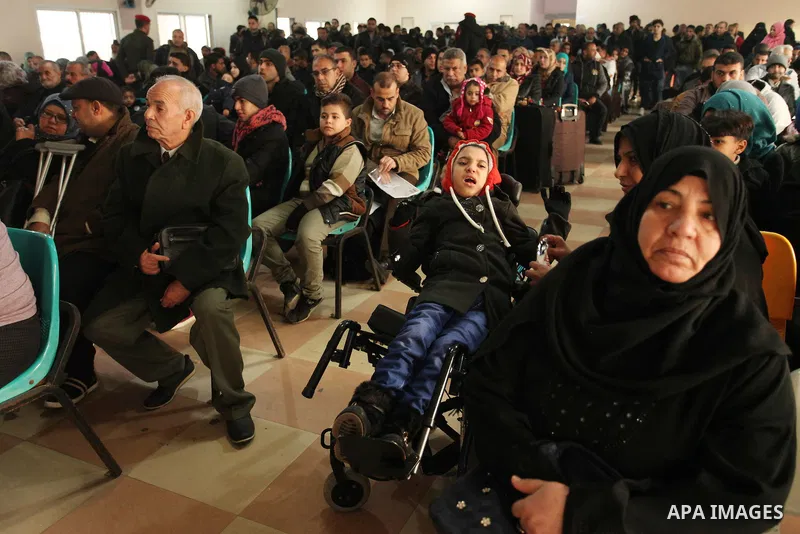 Palestinians wait for travel permits to cross into Egypt through the Rafah border crossing after it was opened by Egyptian authorities for humanitarian cases, in Rafah in the southern Gaza Strip December 17, 2016. Photo...