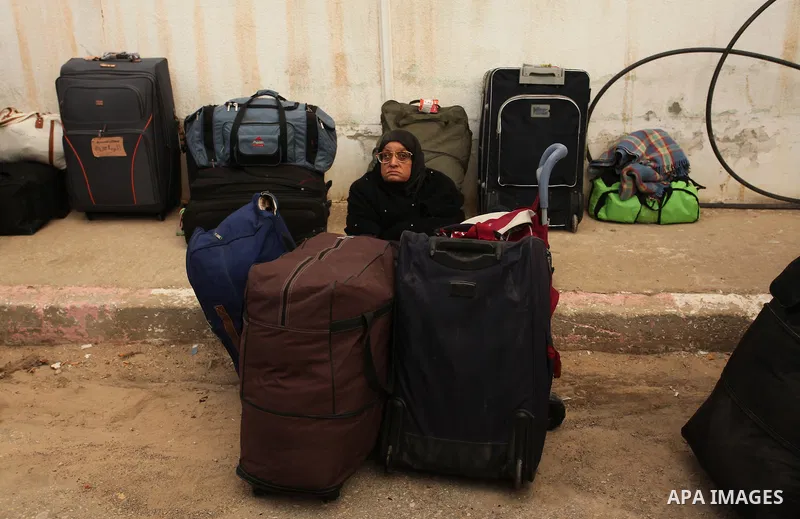 Palestinians wait for travel permits to cross into Egypt through the Rafah border crossing after it was opened by Egyptian authorities for humanitarian cases, in Rafah in the southern Gaza Strip December 17, 2016. Photo...