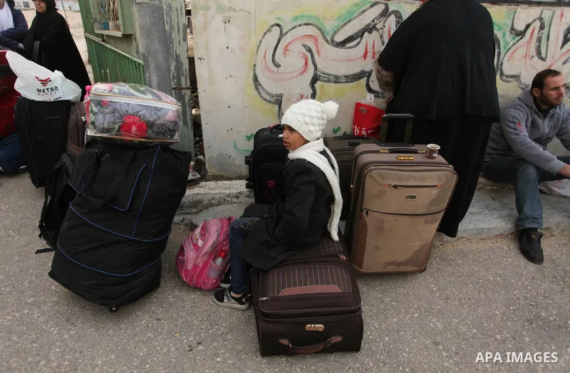 Palestinians wait for travel permits to cross into Egypt through the Rafah border crossing after it was opened by Egyptian authorities for humanitarian cases, in Rafah in the southern Gaza Strip December 17, 2016. Photo...