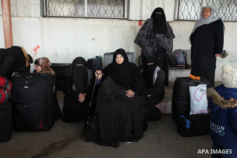 Palestinians wait for travel permits to cross into Egypt through the Rafah border crossing after it was opened by Egyptian authorities for humanitarian cases, in Rafah in the southern Gaza Strip December 17, 2016. Photo...