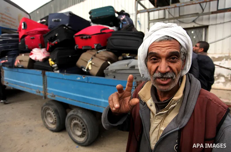 Palestinians wait for travel permits to cross into Egypt through the Rafah border crossing after it was opened by Egyptian authorities for humanitarian cases, in Rafah in the southern Gaza Strip December 17, 2016. Photo...