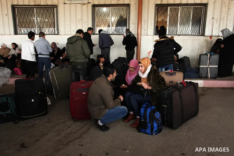 Palestinians wait for travel permits to cross into Egypt through the Rafah border crossing after it was opened by Egyptian authorities for humanitarian cases, in Rafah in the southern Gaza Strip December 17, 2016. Photo...