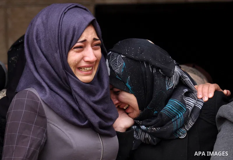 Relatives of Palestinian Rahiq Birawi, who according to the Israeli police was shot dead after she had advanced towards them with a knife in her hand at a checkpoint last October, mourn during her funeral after Israel re...