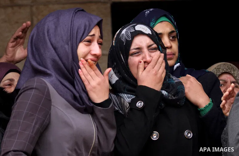 Relatives of Palestinian Rahiq Birawi, who according to the Israeli police was shot dead after she had advanced towards them with a knife in her hand at a checkpoint last October, mourn during her funeral after Israel re...