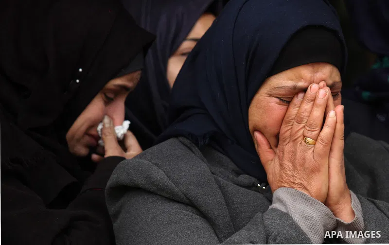 Relatives of Palestinian Rahiq Birawi, who according to the Israeli police was shot dead after she had advanced towards them with a knife in her hand at a checkpoint last October, mourn during her funeral after Israel re...