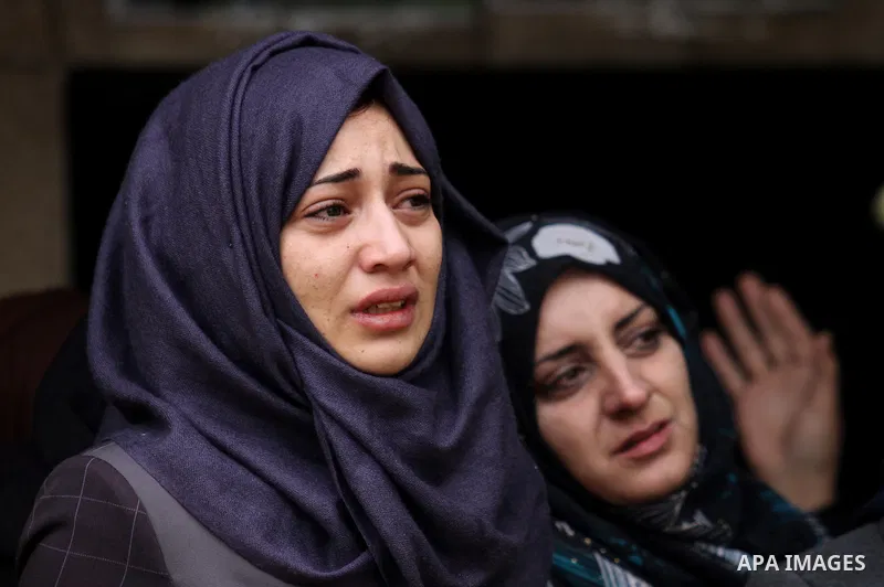 Relatives of Palestinian Rahiq Birawi, who according to the Israeli police was shot dead after she had advanced towards them with a knife in her hand at a checkpoint last October, mourn during her funeral after Israel re...