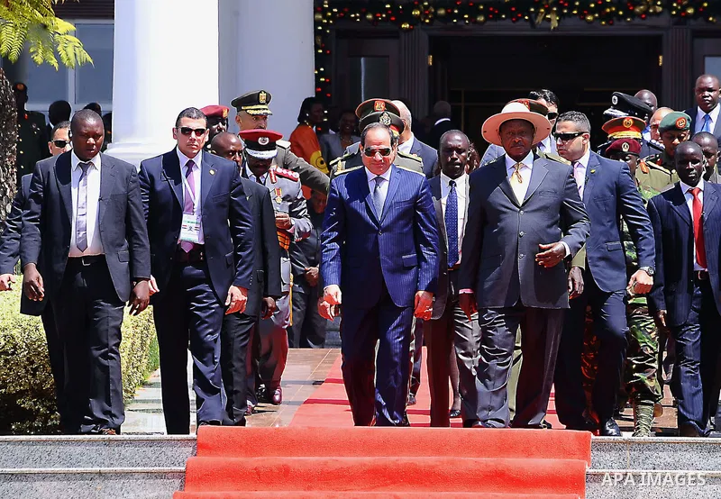 Egyptian President Abdel Fattah al-Sisi walks alongside Ugandan President Yoweri Museveni during his visit to Ugandan capital Kampala, on December 18, 2016. Photo by Egyptian President Office