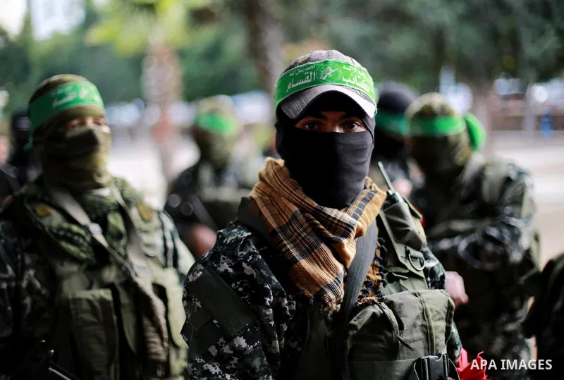 Members of the Ezzedine al-Qassam Brigades, the military wing of the Palestinian Islamist movement Hamas, take part in mourning tent of a Tunisian Mohammed Zawari, in Gaza city, on December 18, 2016. The Palestinian Hama...