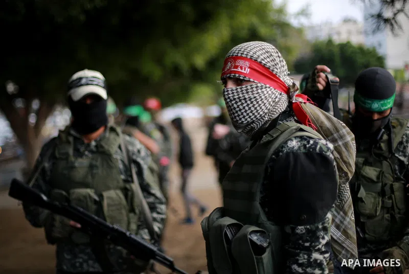 Members of the Ezzedine al-Qassam Brigades, the military wing of the Palestinian Islamist movement Hamas, take part in mourning tent of a Tunisian Mohammed Zawari, in Gaza city, on December 18, 2016. The Palestinian Hama...