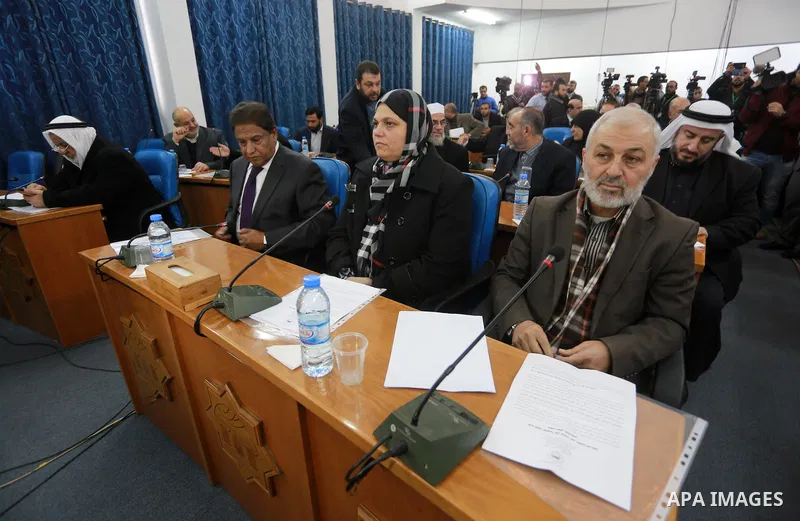 Members of the Palestinian legislative council from Hamas movement attend a meeting at the legislative council in Gaza city, on December 21, 2016. Photo by Mohammed Asad