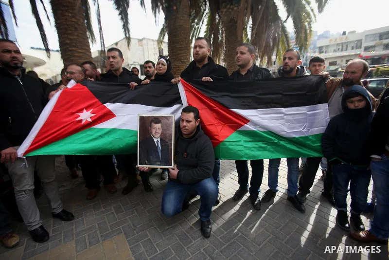 Palestinians take part during a protest to show solidarity with Jordan against terrorist attacks in the West Bank city of Nablus, on December 21, 2016. Jordanian security forces have arrested a man suspected of funding a...
