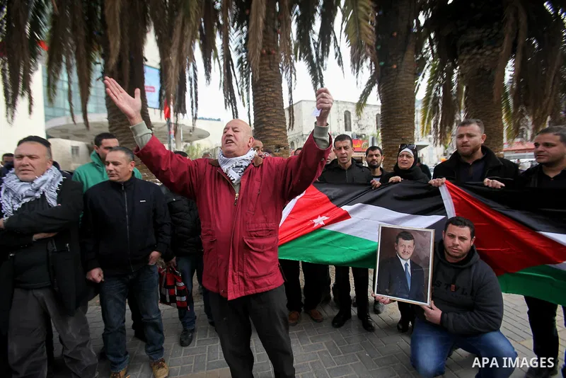 Palestinians take part during a protest to show solidarity with Jordan against terrorist attacks in the West Bank city of Nablus, on December 21, 2016. Jordanian security forces have arrested a man suspected of funding a...