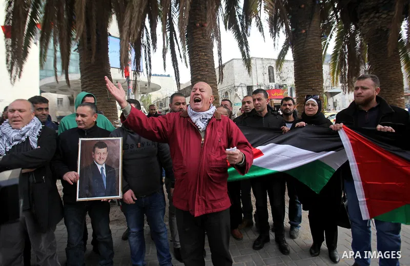 Palestinians take part during a protest to show solidarity with Jordan against terrorist attacks in the West Bank city of Nablus, on December 21, 2016. Jordanian security forces have arrested a man suspected of funding a...